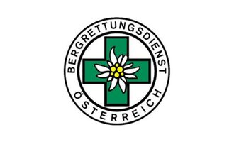 Ein Logo des Bergrettungsdienstes Österreich. Es zeigt ein grünes Kreuz mit einer Alpenblume in der Mitte. | © Bergrettung Mittelberg Hirschegg Logo