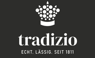 A simple logo of tradizio with a crown made of dots. The slogan says: "Real. Casual. Since 1811." | © tradizio_logo_